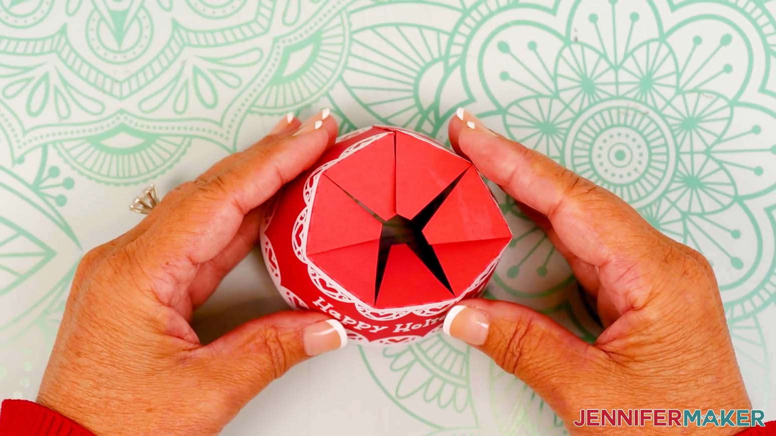Attach the opposite side of the lid flush with the glued tab’s crease line to form the circular snow globe gift box lid.