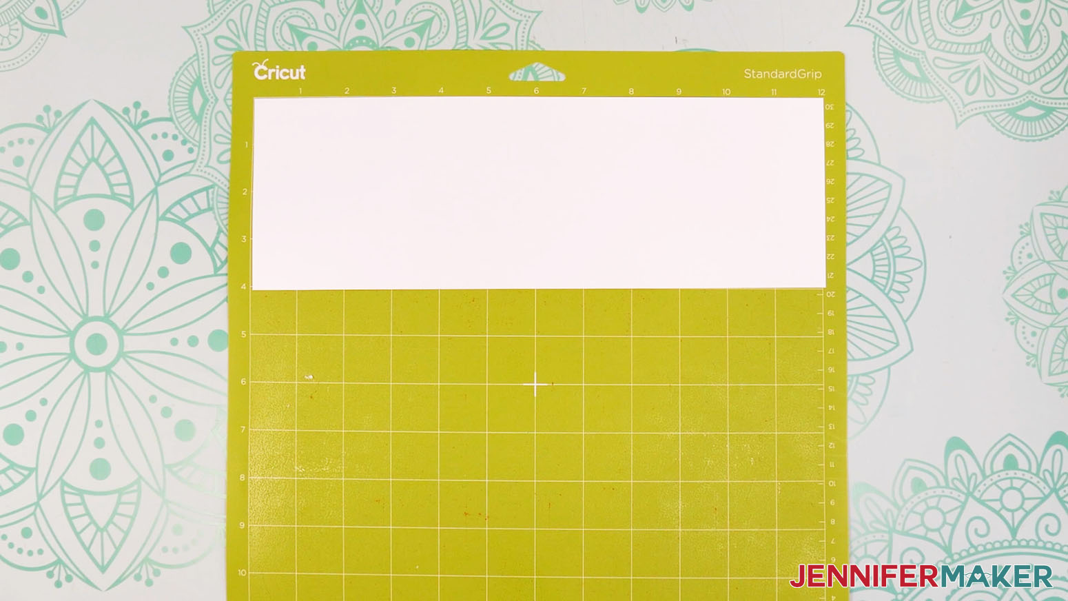 White vinyl on a green machine mat.
