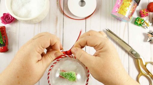 Glue and or tie on the ribbon to the lid of your Mason jar