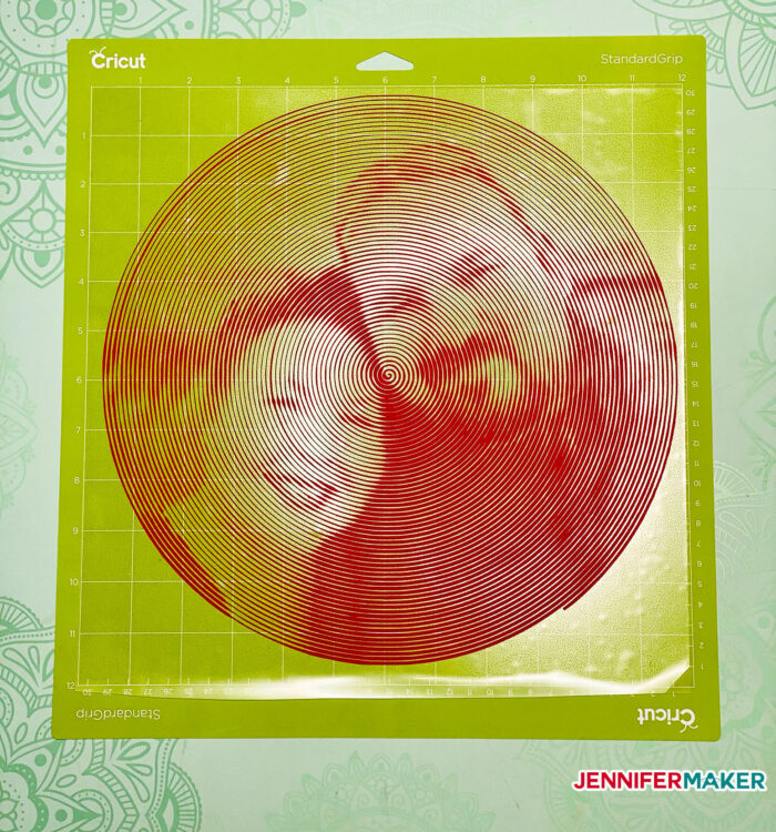 Spiral Betty photo cut from red iron on vinyl on a green standard grip cutting mat