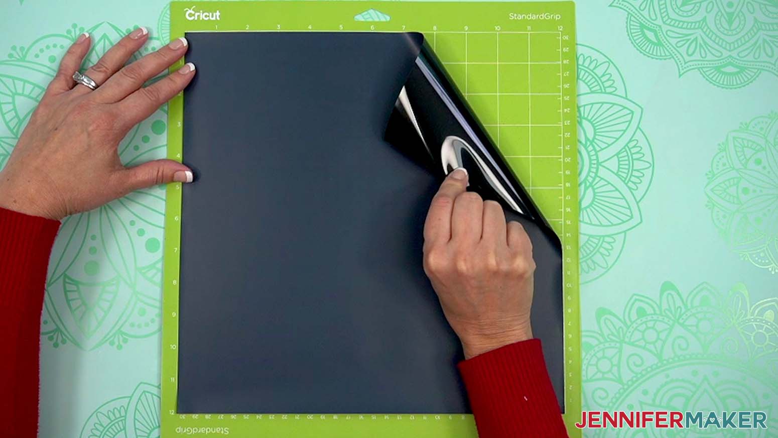 place heat transfer vinyl shiny side down on a green StandardGrip machine mat.