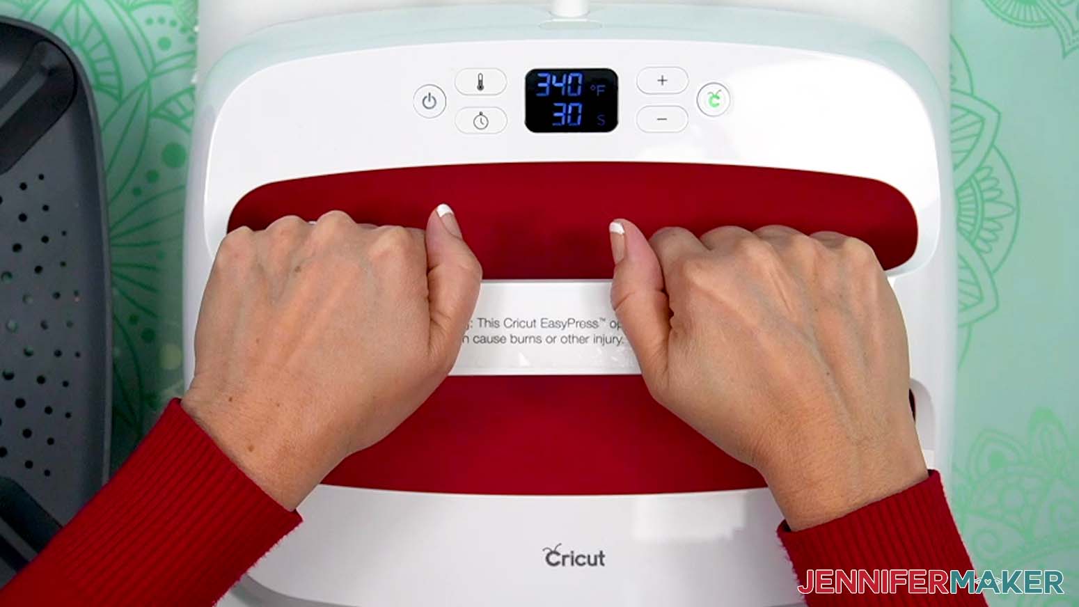 Use a heat press to press the iron-on vinyl design on the blank canvas.