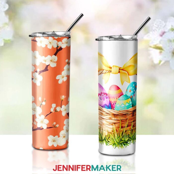 A skinny tumbler with an orange background and white flowers on a branch, plus a skinny tumbler with a basket full of easter eggs. Designs by Jennifer Maker.