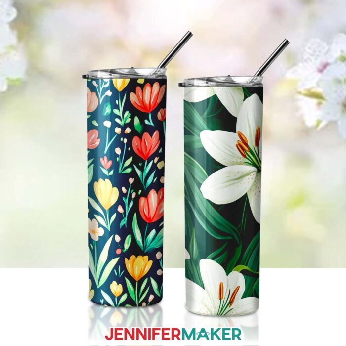 A skinny tumbler with colorful flowers on a dark background, plus a tumbler with white flowers on a green leaf background. Designs by JenniferMaker.
