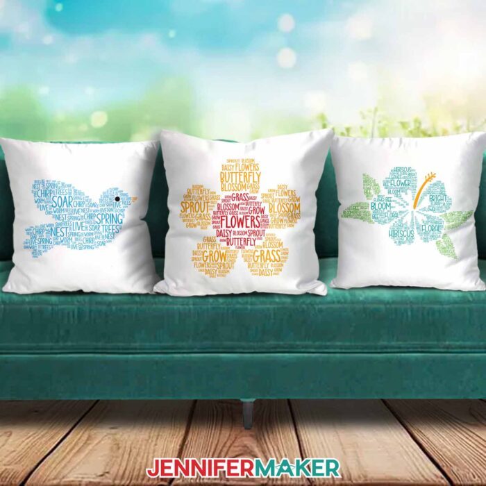 Three pillows decorated with Spring Word Art designs on a green couch, featuring bird and flower designs made up of colorful spring-related words