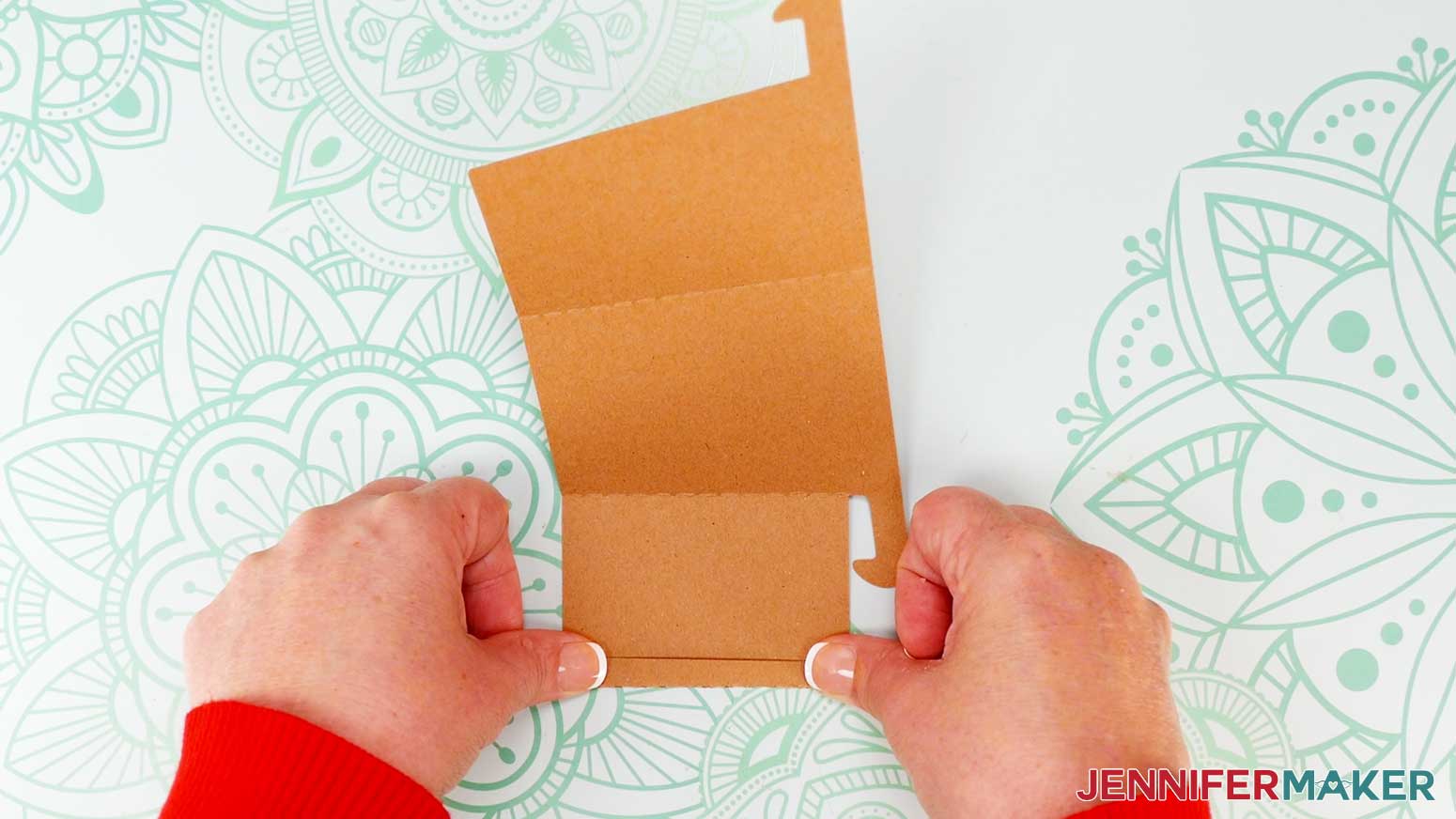 On the stand, fold along the crease lines, all in the same direction, to create three panels.