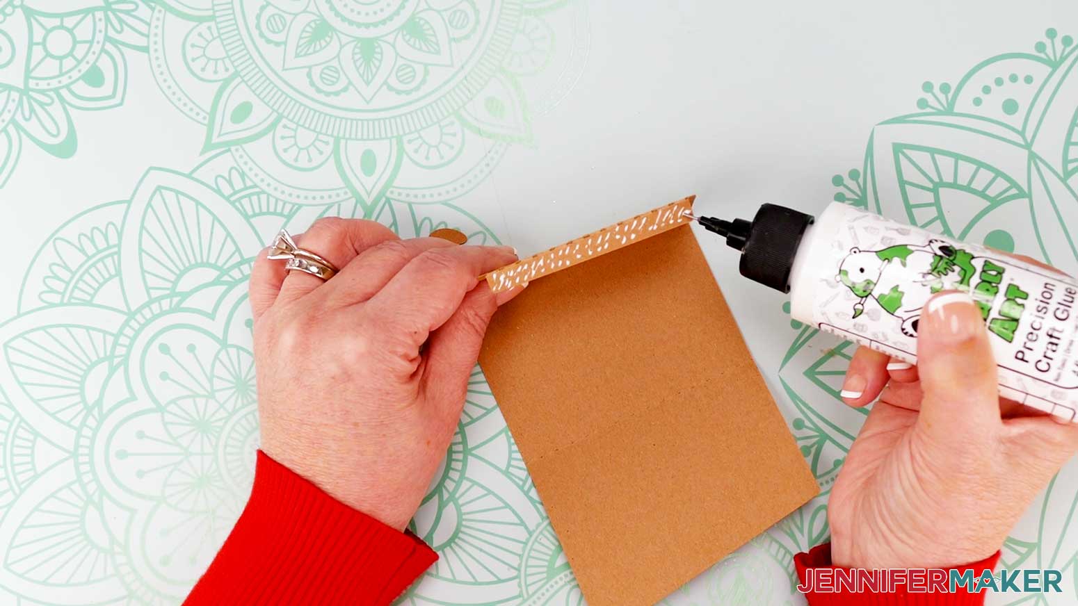 Apply craft glue along the outside of the smallest folded panel.