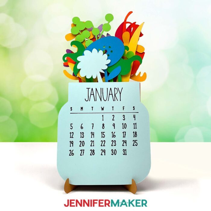 A Stacked Calendar with a multicolor floral design sits on display in a sunny space