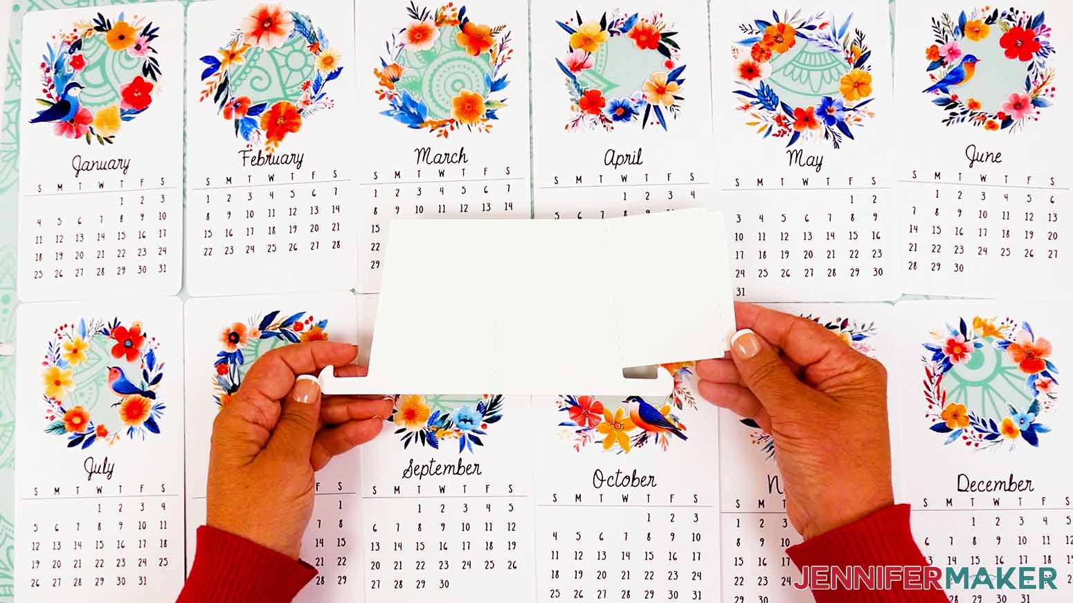Spread out each of the stacked desk calendar cards and stand piece to review them and make sure they are ready to use.
