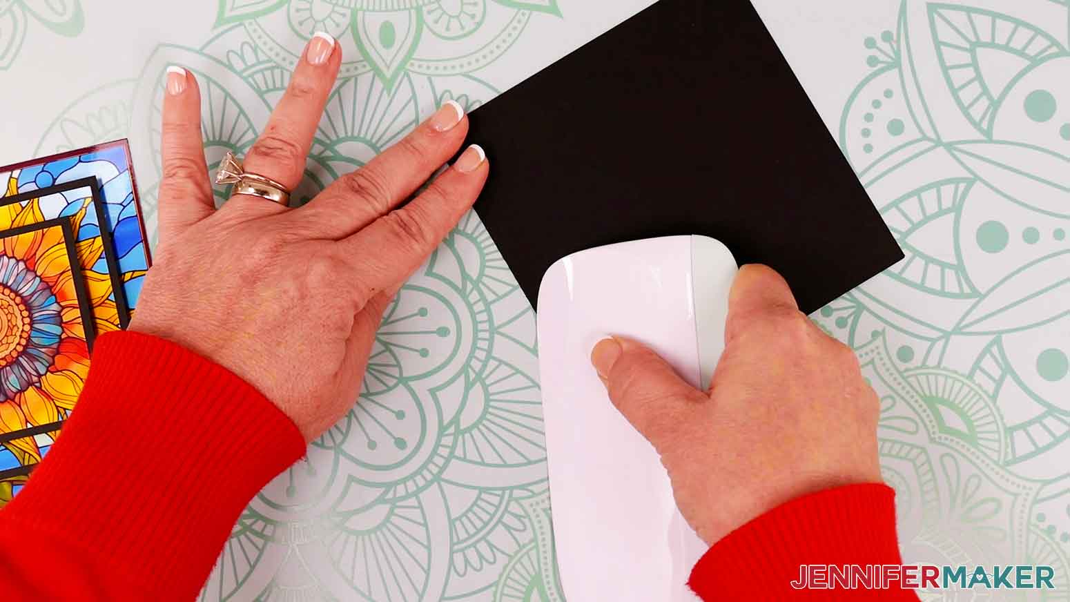 Fold the base card in hall and use a scraper tool along the crease.