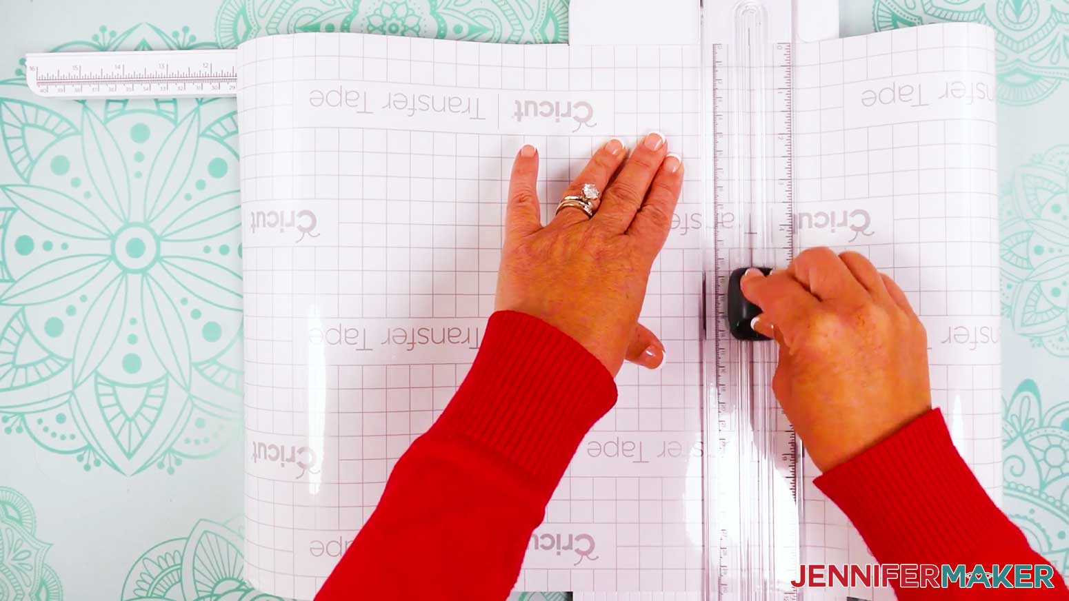 Use the trimmer to cut a piece of carrier sheet to slightly bigger than the size of the vinyl layer of the stained glass design.