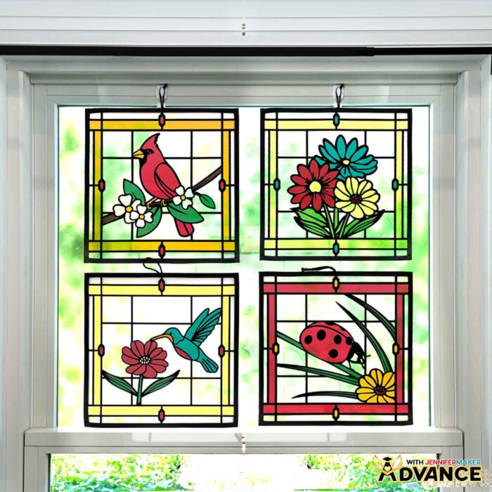 Make Stained Glass Using Paper! Four stained glass projects depicting a cardinal, flowers, a hummingbird, and a ladybug hang in a sunny window