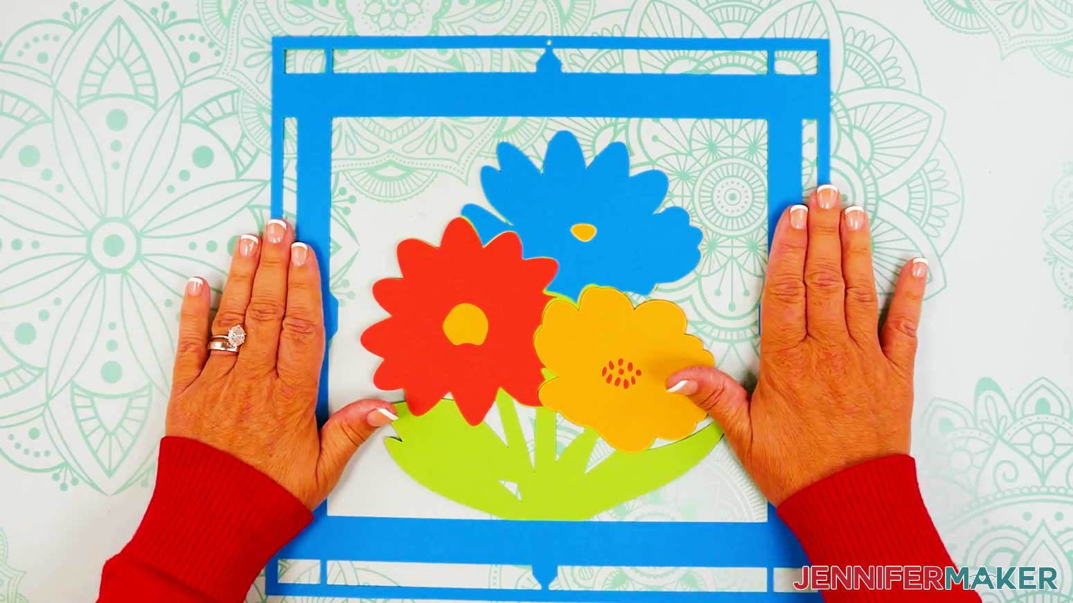 Place the frame piece with the solid gem stone areas onto the back cardstock layer of the stained glass design.