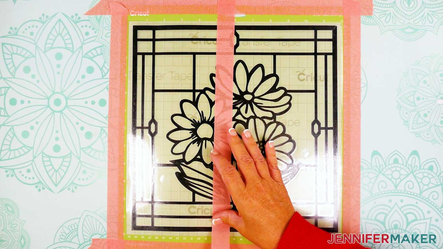 Place a piece of painters tape over the center of the stained glass design.