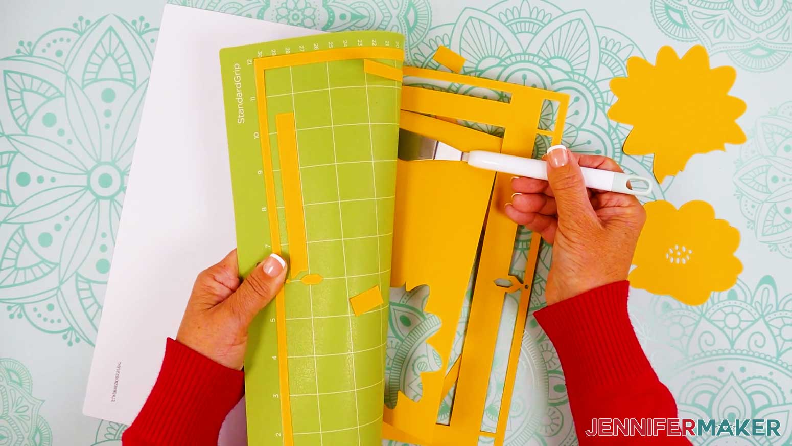 Use a spatula to lift delicate items from the machine mat when cutting the cardstock pieces for the stained glass design.