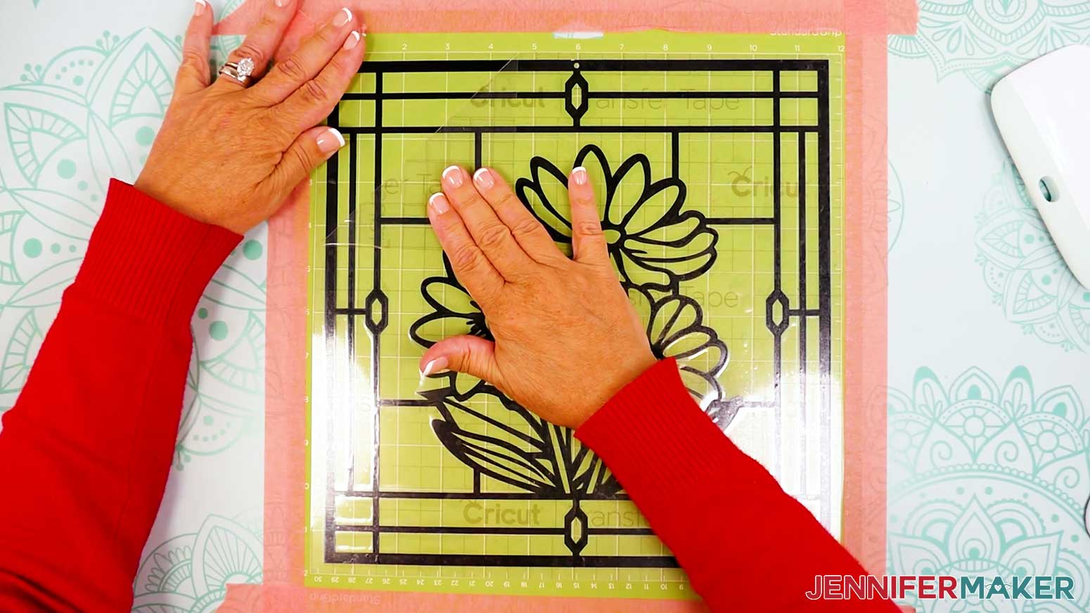 Carefully peel the transfer tape away from acetate and vinyl layer of the stained glass design.