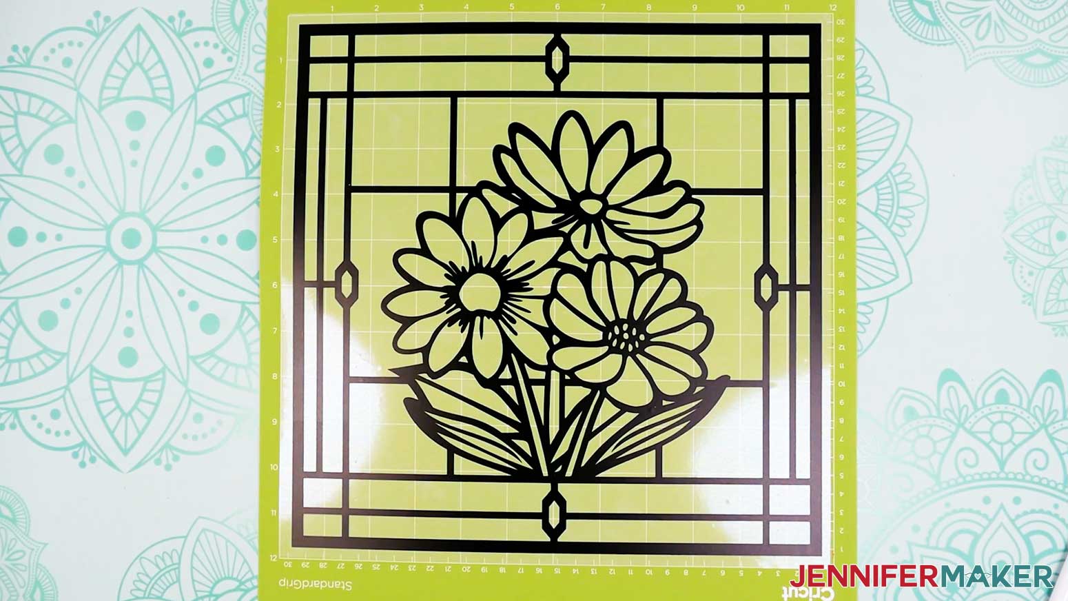 The vinyl black layer of the stained glass design is weeded and ready to use.