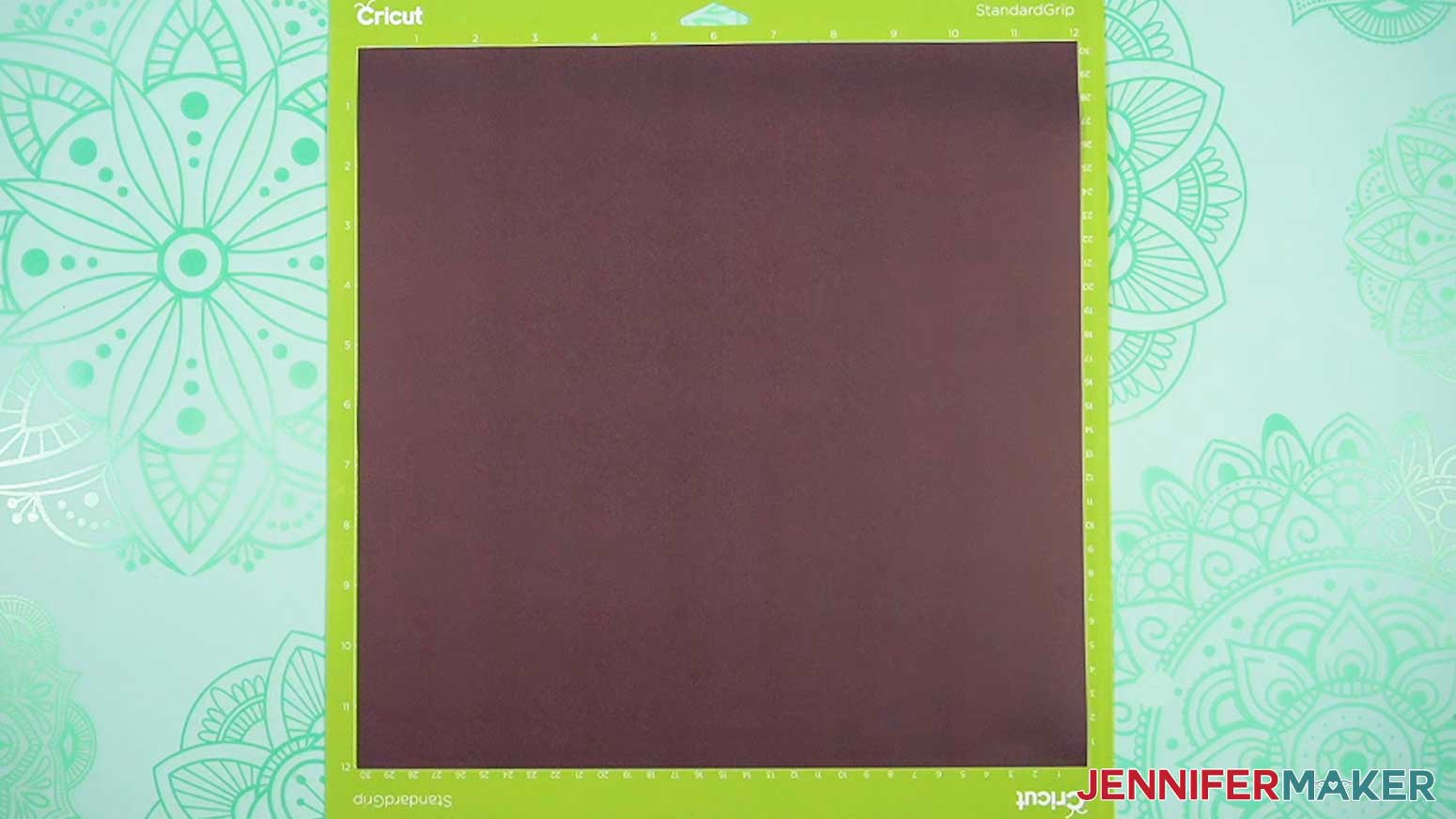 Place the black infusible ink sheet on the green machine mat.