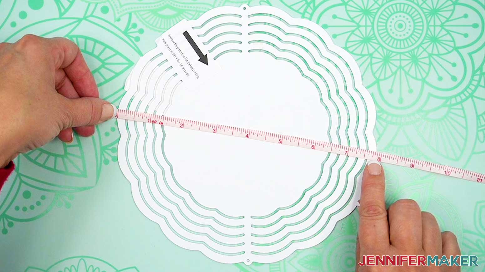 Use a measuring tape to measure the width of the blank sublimation wind spinner.
