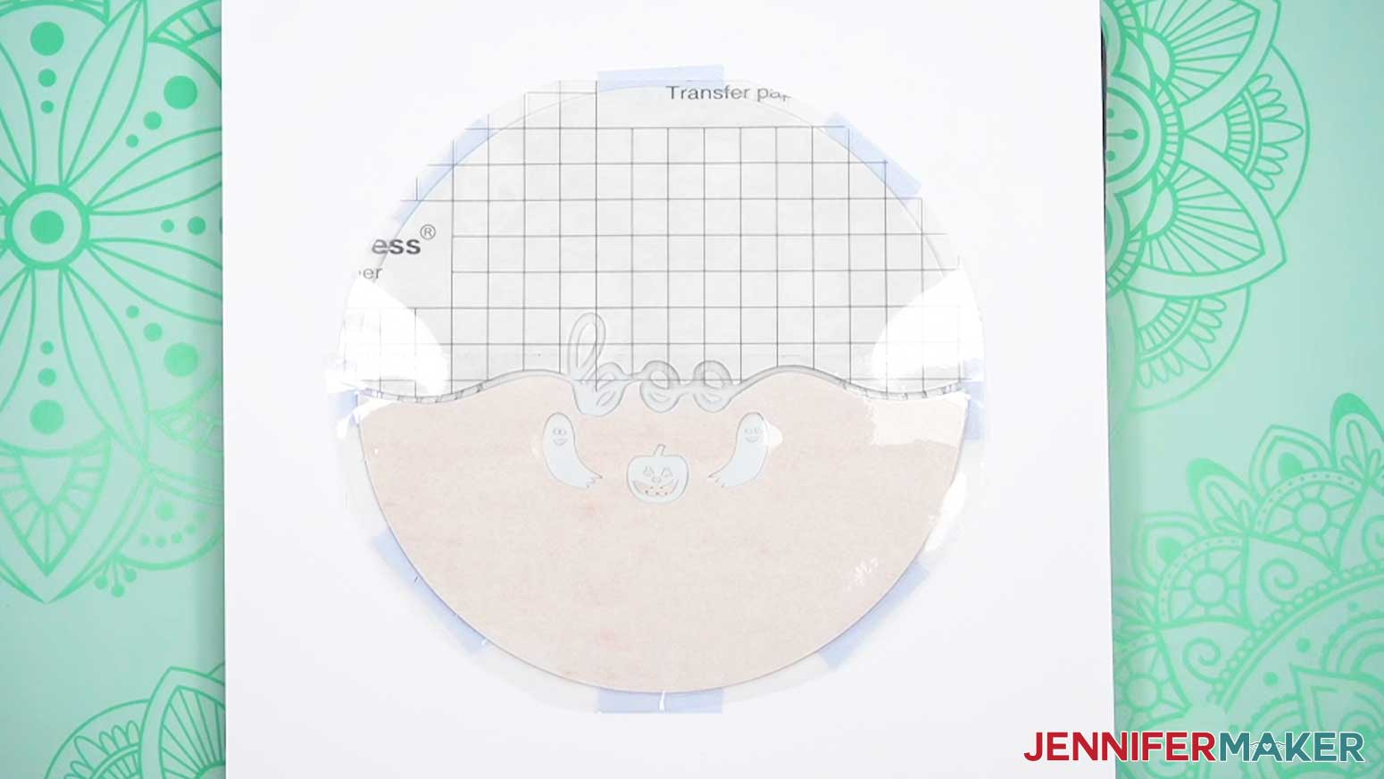 Place the wind spinner and design face down on the cardstock on the pressing mat.