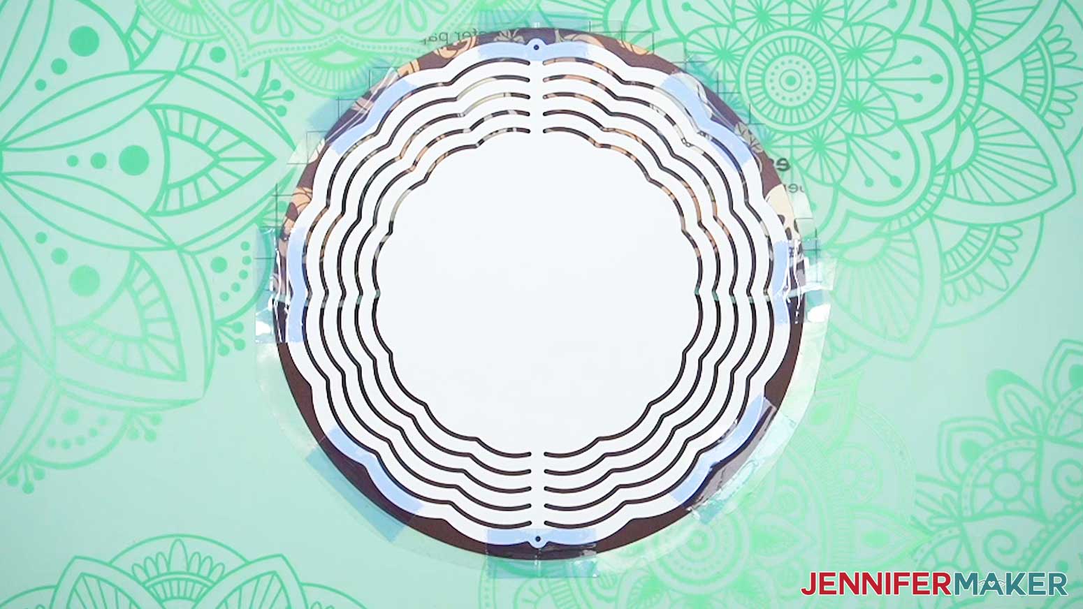 Place the wind spinner blank on the infusible ink design and secure with heat resistant tape.