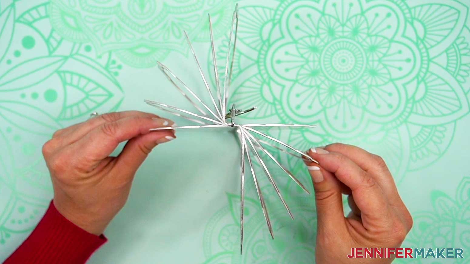 Adjust the wind spinner rings for even display.