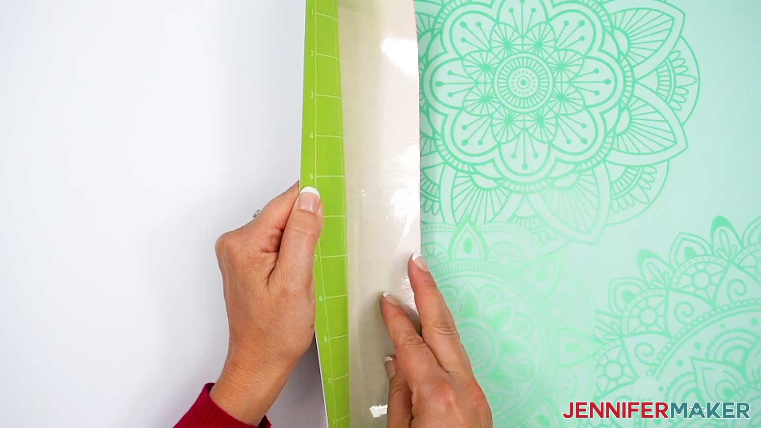 Flip the machine mat over and gently roll it away from the infusible ink transfer sheet.