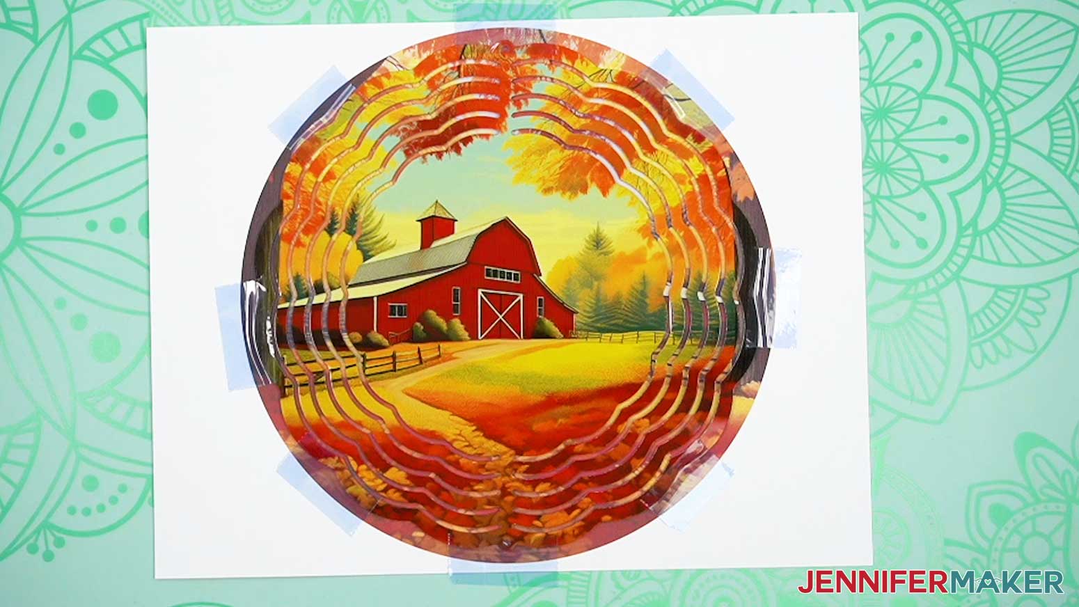 Use heat resistant tape to tape the blank side of the wind spinner to the second sublimation print.