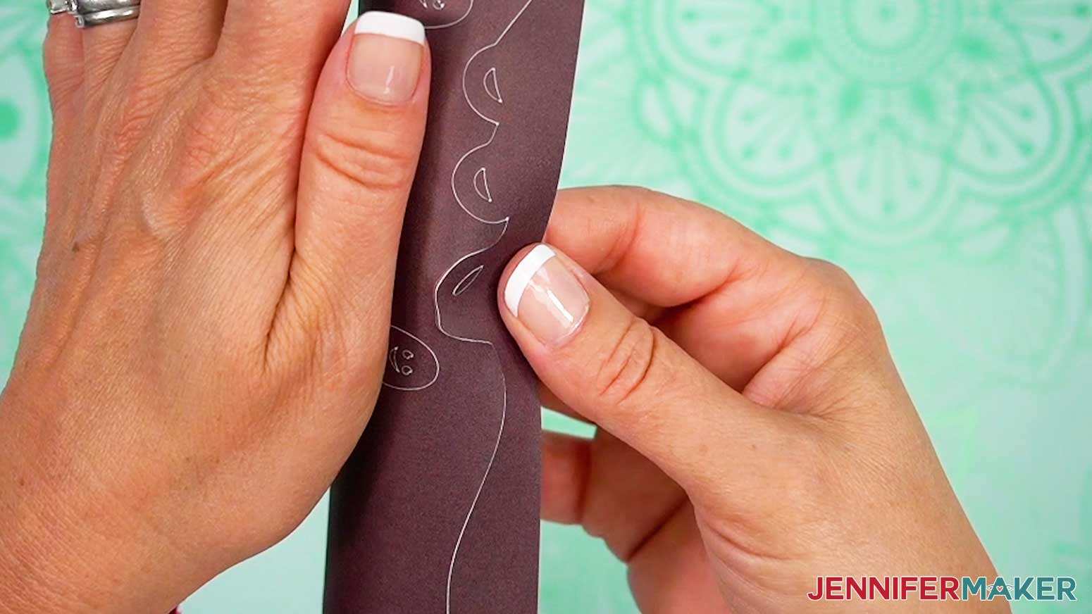 Roll the infusible ink transfer sheet to crack the design away from the carrier sheet.