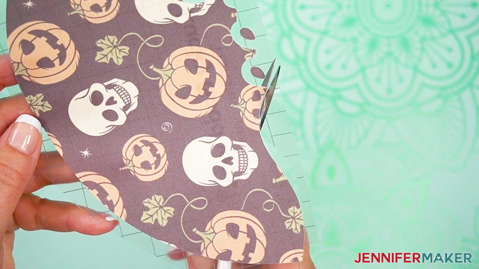 Use scissors to trim the carrier sheet close to the design.