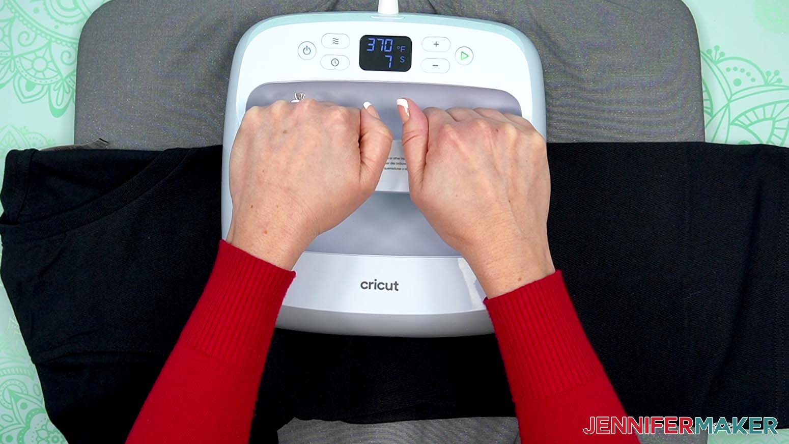When the machine comes to temperature, fold the shirt in half the long way and press it for 10 seconds with medium pressure to remove moisture and create a center crease.