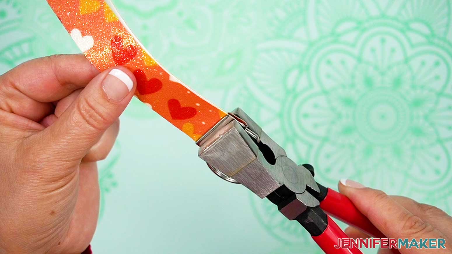 Squeeze the pliers to secure the clamp to the faux leather.