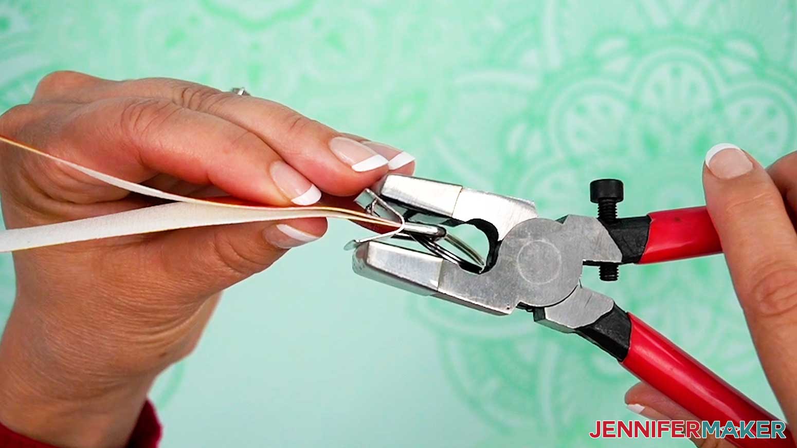 Press the end of the faux leather inside the clamp and press it closed with the pliers.