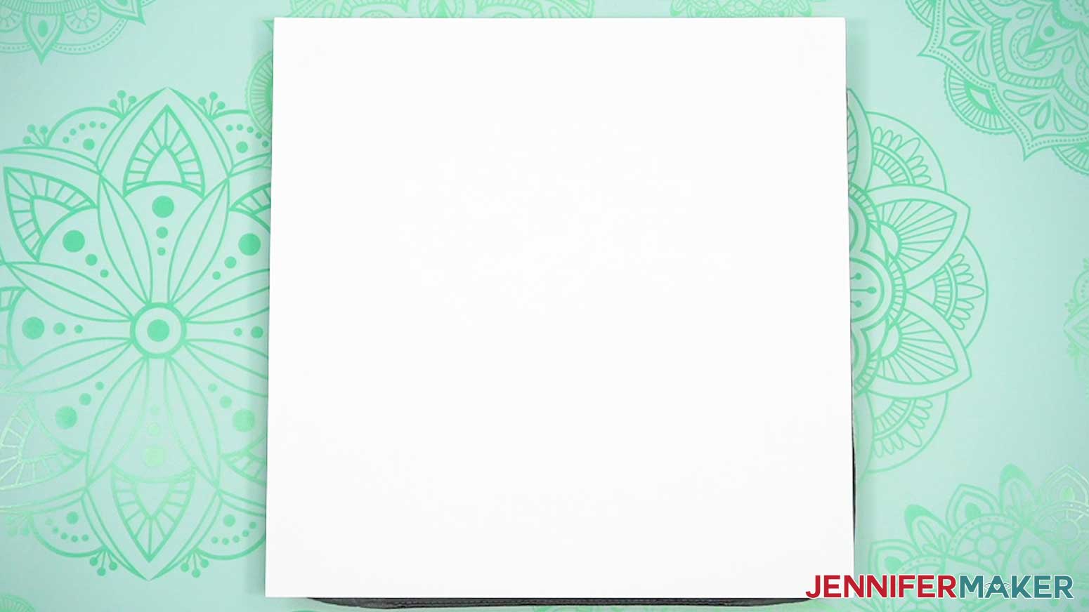 Place a clean sheet of white cardstock on the pressing mat to protect it from any ink blowout.