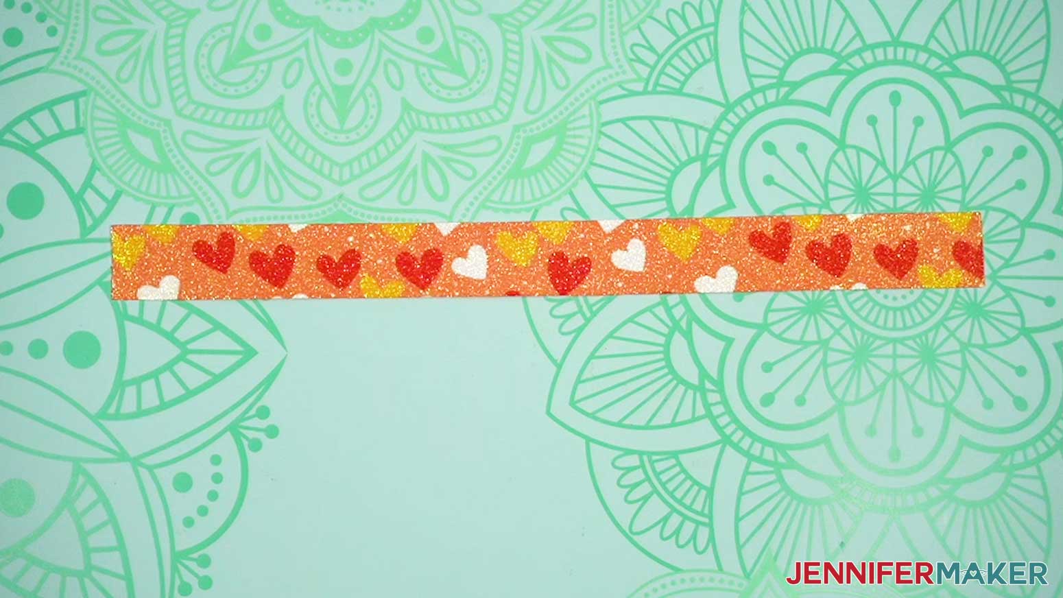 Sublimated strip of glitter faux leather.