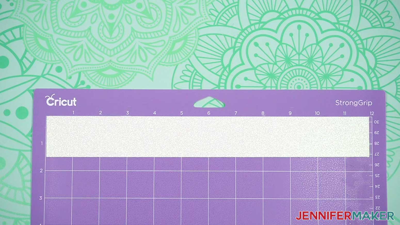Press the faux leather with the glitter facing up on a StrongGrip machine mat.