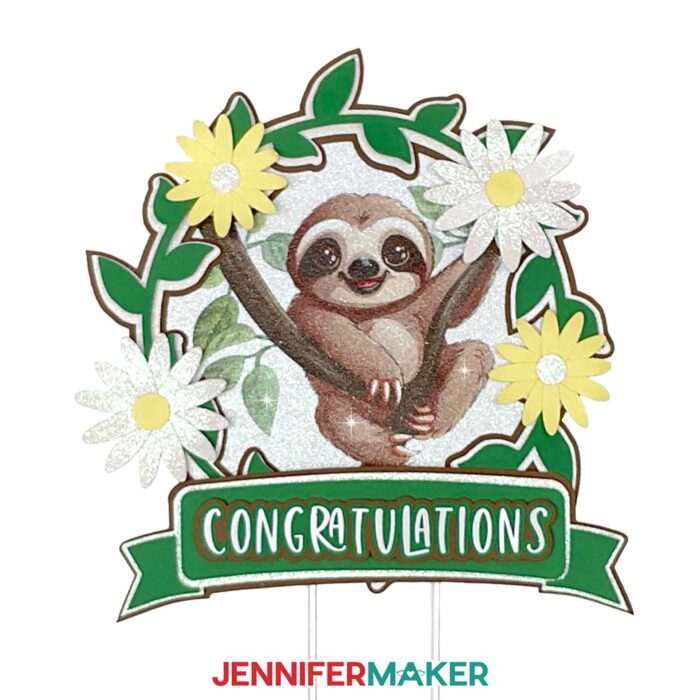 Decorative cake topper with a sloth illustration sublimated on glitter cardstock.