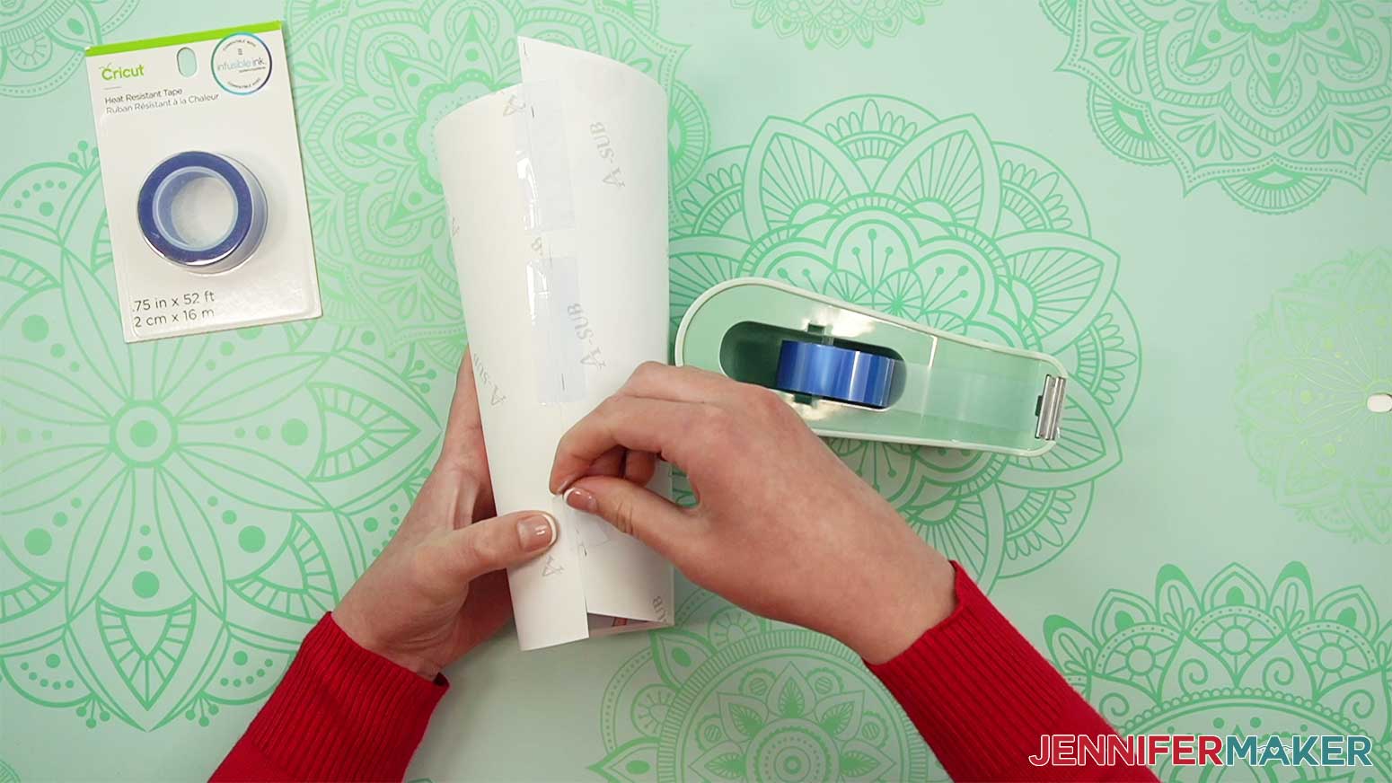 Tape the edges of the sublimation paper together around your tumbler