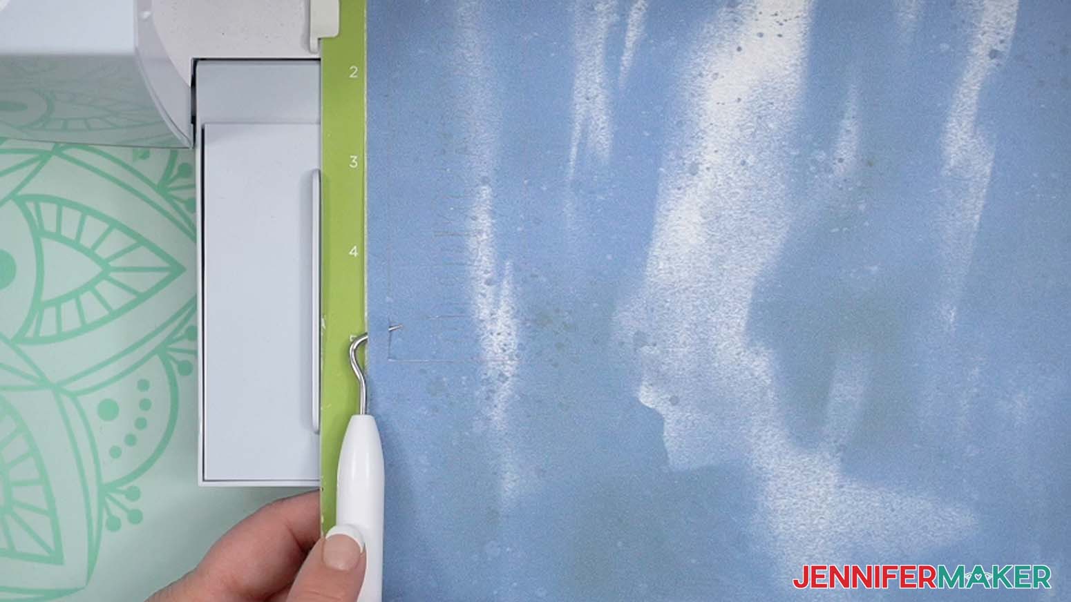 Use your weeding tool to lift a corner of the design to see if the cut went all the way through.
