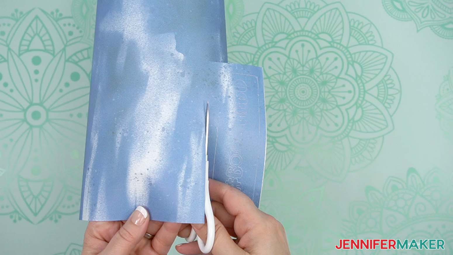 use scissors or a paper trimmer to cut excess paper off.