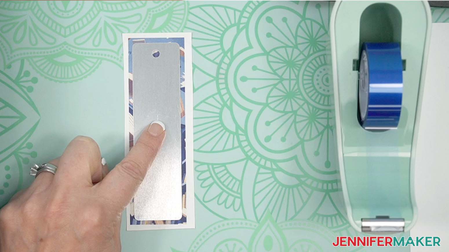 Place the bookmark’s white side down onto the design .