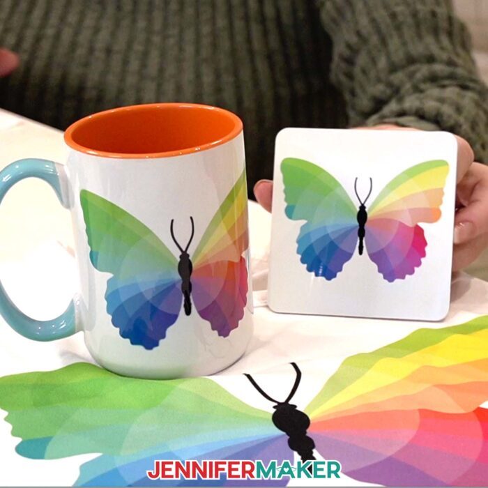 A close-up view of the sublimated mug, coaster, and T-shirt featuring the Sublifly color wheel butterfly. Learn to make them with these sublimation basics for beginners!