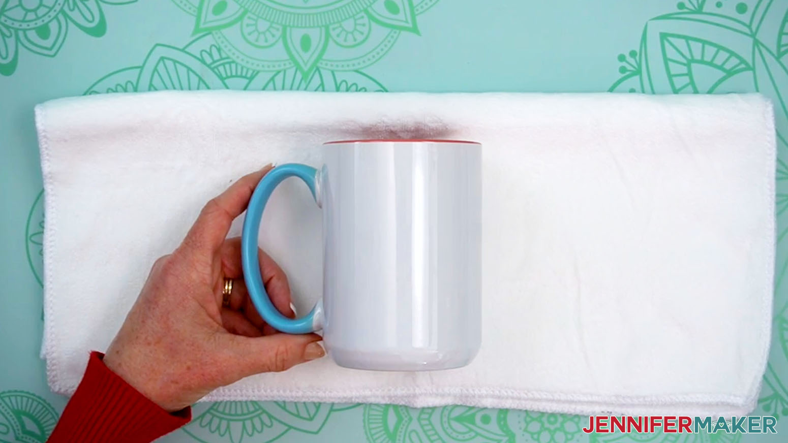 Position the mug to be used for the Sublimation Basics design on a soft towel.