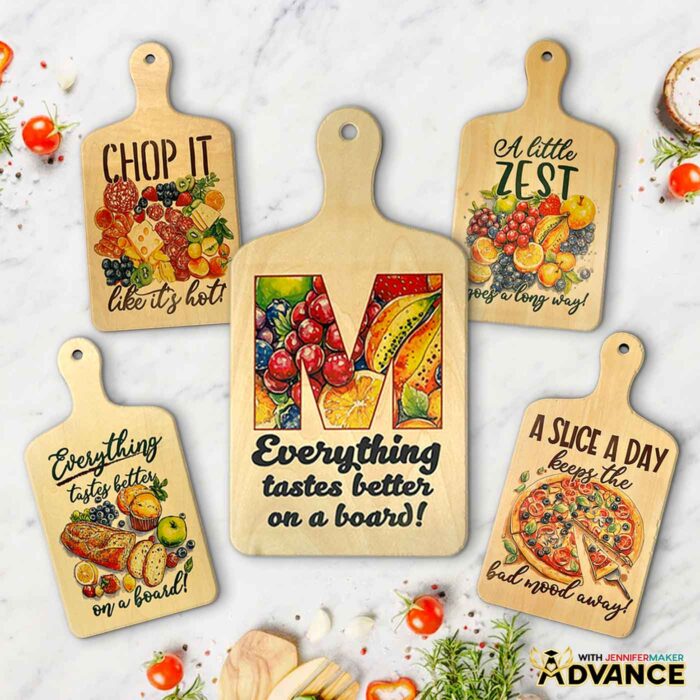 Five charcuterie boards made with sublimation rest on a marble countertop.