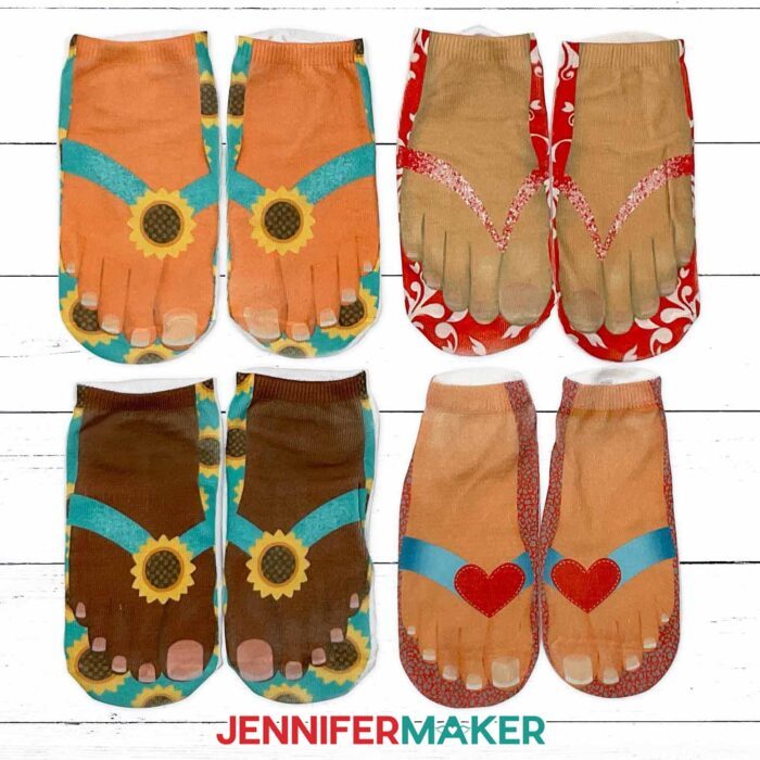 Four examples of sublimation socks made using the JenniferMaker tutorial. The designs show feet in various skin tones wearing flip flops.