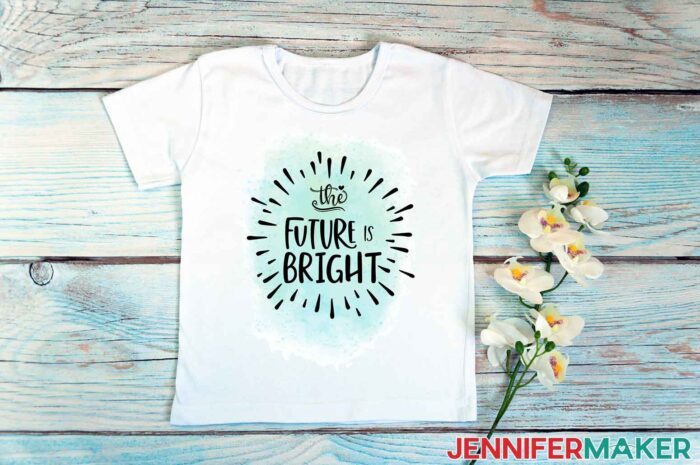 White t-shirt with a blue and black sublimation design that reads "the future is bright" with flowers