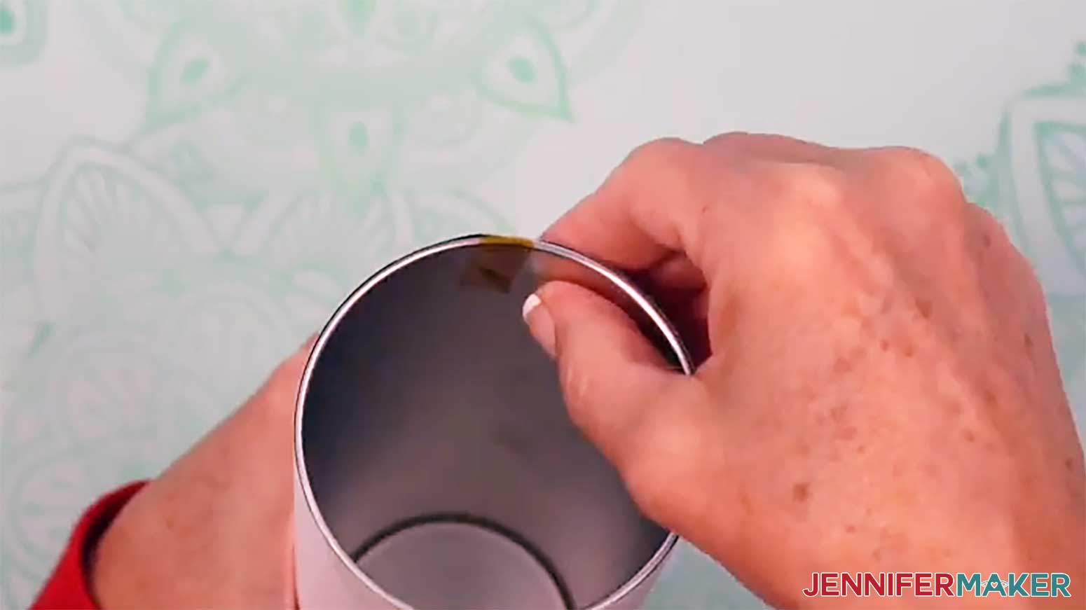 Push the tape over the top and into the glow in the dark tumbler.
