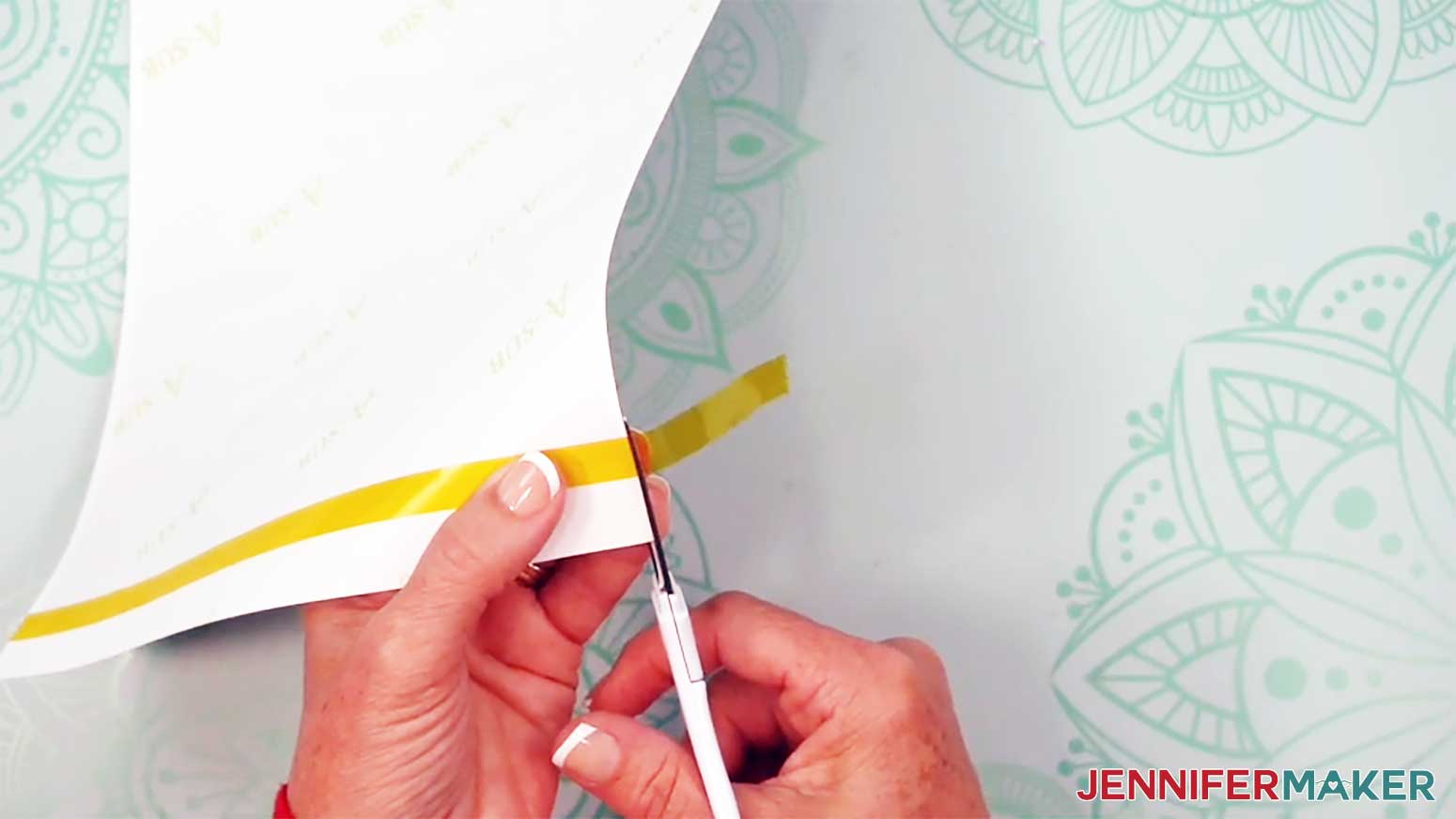 Trim the end of the tape to the edge of the glow in the dark tumbler sublimation print.