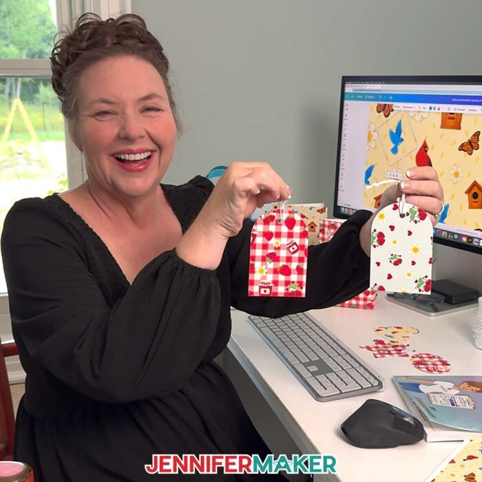 Jennifer Maker shows of a paper gift tags she made with paper printed with a Seamless Pattern In Canva she made