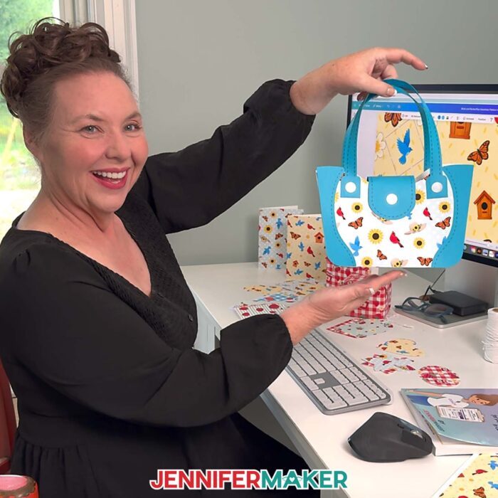 Jennifer Maker shows of a paper purse gift bag she made with paper printed with a Seamless Pattern In Canva she made